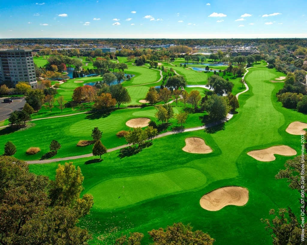 Panoramic view of a lush green golf course at Willow Crest Golf Club. Smooth