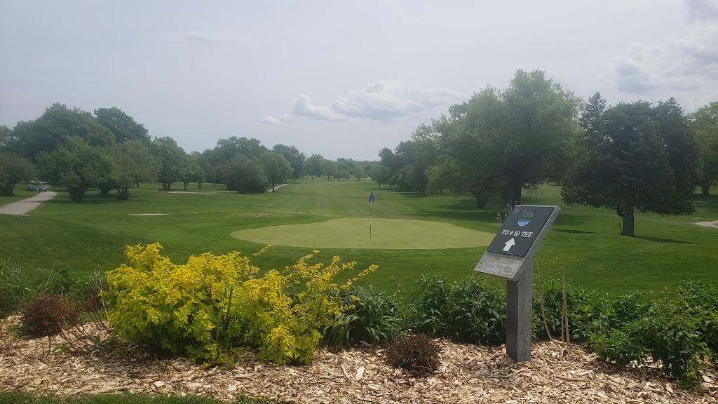 Panoramic view of a lush green golf course at Willow Lakes Golf Course. Smooth