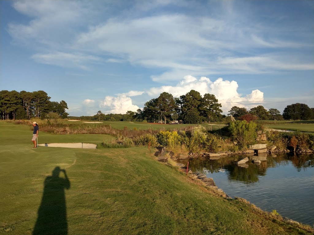 Panoramic view of a lush green golf course at Willow Point Country Club. Smooth