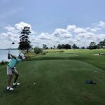 Panoramic view of a lush green golf course at Willow Point Golf Course. Smooth