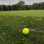 Panoramic view of a lush green golf course at Willowbrook Golf Course. Smooth