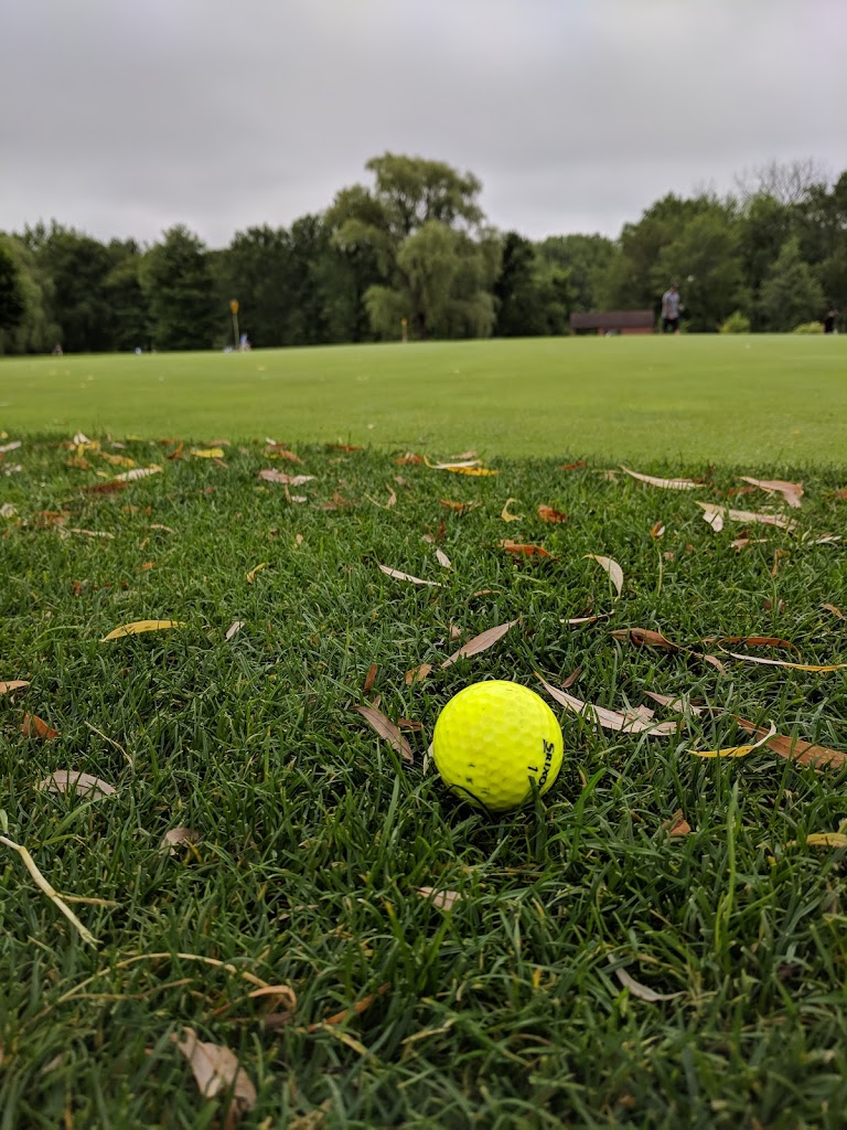 Panoramic view of a lush green golf course at Willowbrook Golf Course. Smooth