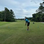 green grass with the flag in the hole.