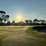 Panoramic view of a lush green golf course at Wilmington Municipal Golf Course. Smooth
