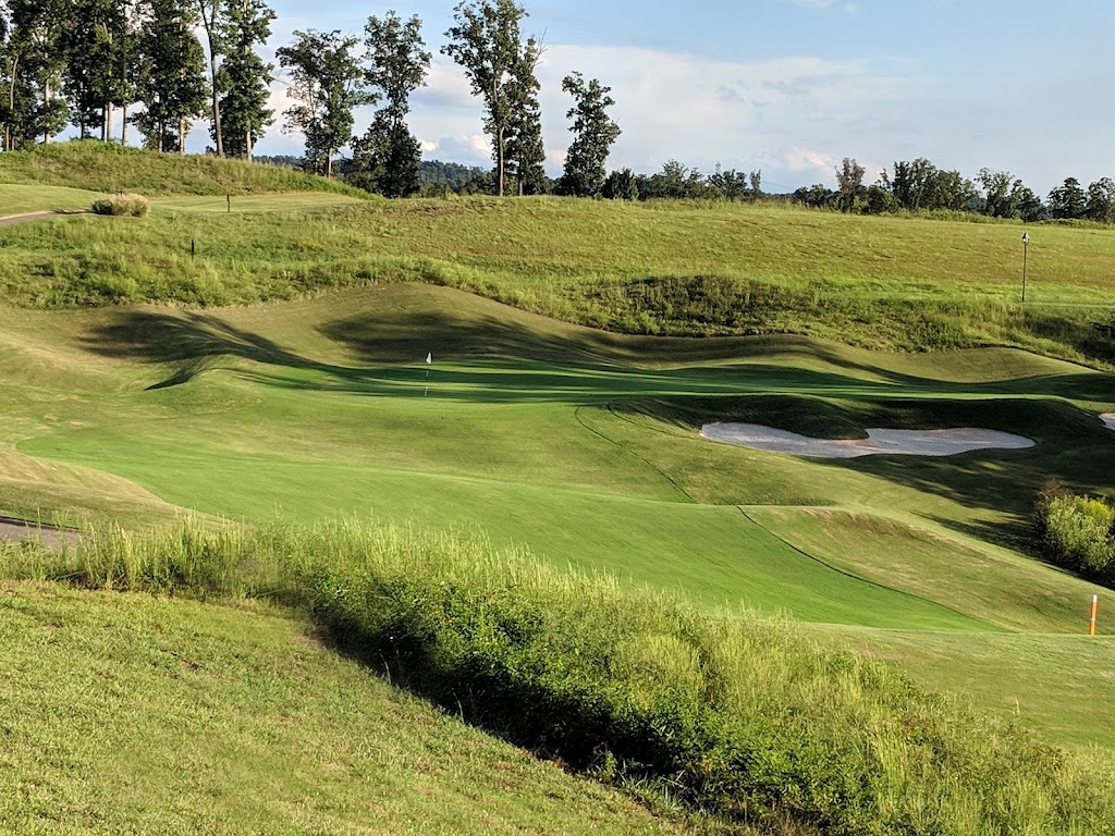 Panoramic view of a lush green golf course at WindRiver Golf Club. Smooth
