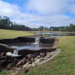 Panoramic view of a lush green golf course at Windance Country Club. Smooth