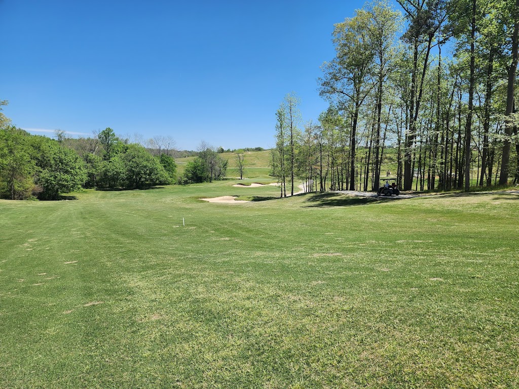 Panoramic view of a lush green golf course at Winding Creek Golf Course. Smooth
