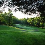Panoramic view of a lush green golf course at Winding Hills Golf Club. Smooth