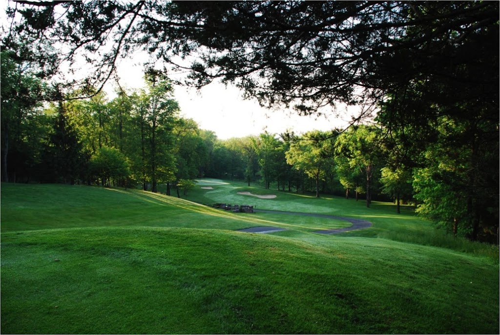 Panoramic view of a lush green golf course at Winding Hills Golf Club. Smooth