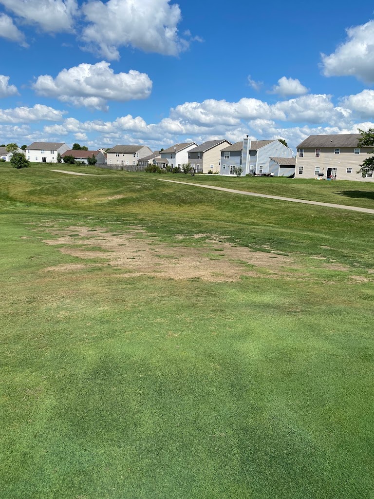 Panoramic view of a lush green golf course at Winding Ridge Golf Club. Smooth