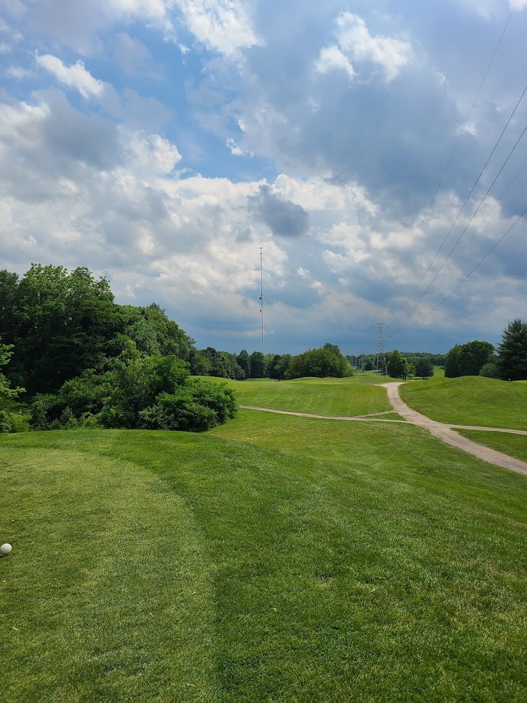 Panoramic view of a lush green golf course at Winding River Golf Course. Smooth