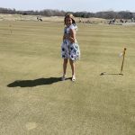 green grass with the flag in the hole.