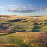 Panoramic view of a lush green golf course at Wine Valley Golf Club. Smooth