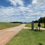 Panoramic view of a lush green golf course at Winter Creek Golf & Social Club. Smooth