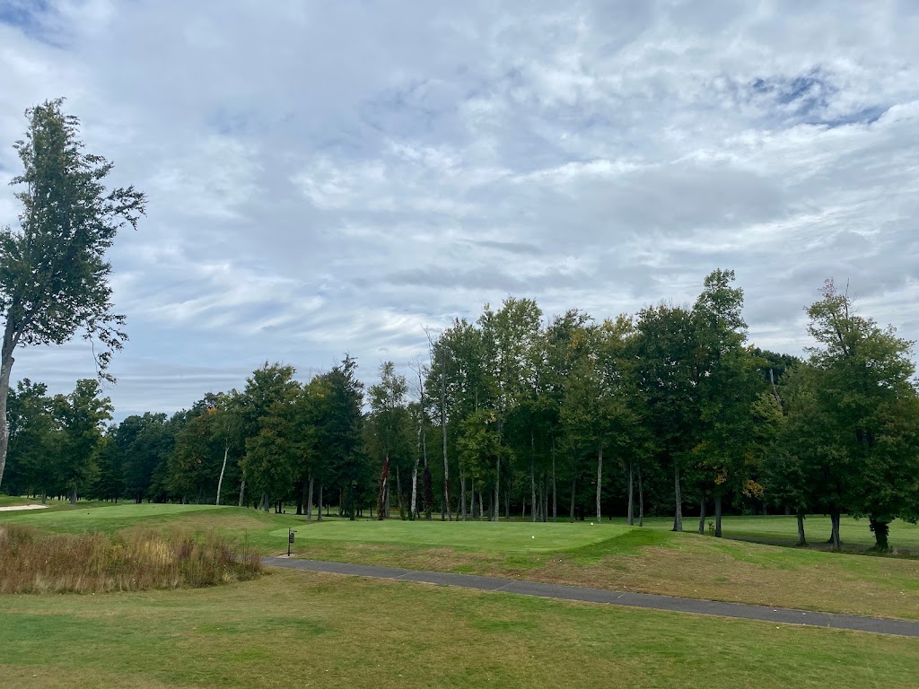 Panoramic view of a lush green golf course at Wintonbury Hills Golf Course. Smooth