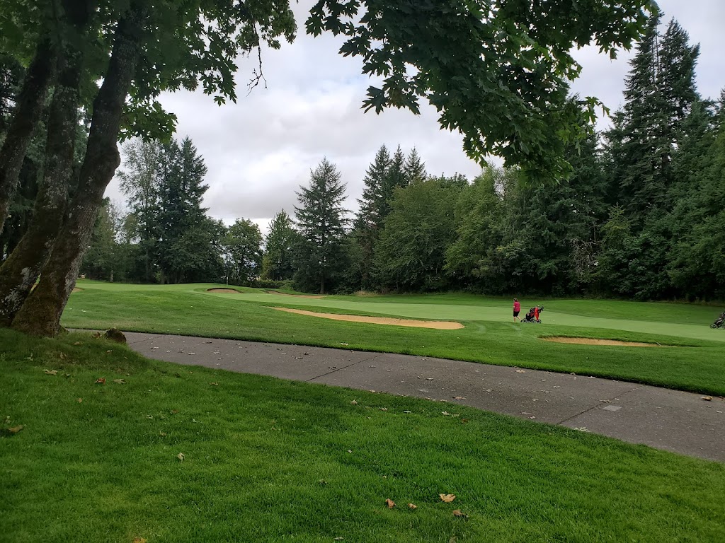 Panoramic view of a lush green golf course at Witch Hollow Golf Course. Smooth