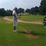 green grass with the flag in the hole.