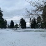 Panoramic view of a lush green golf course at Woodburn Golf Club. Smooth