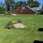 Panoramic view of a lush green golf course at Woodbury Golf Course. Smooth