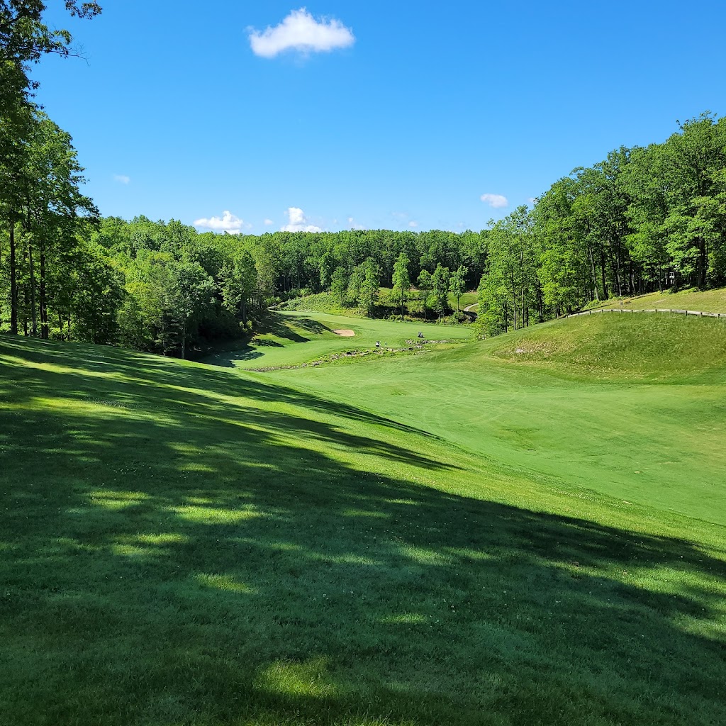 Panoramic view of a lush green golf course at Woodhaven Golf Course. Smooth