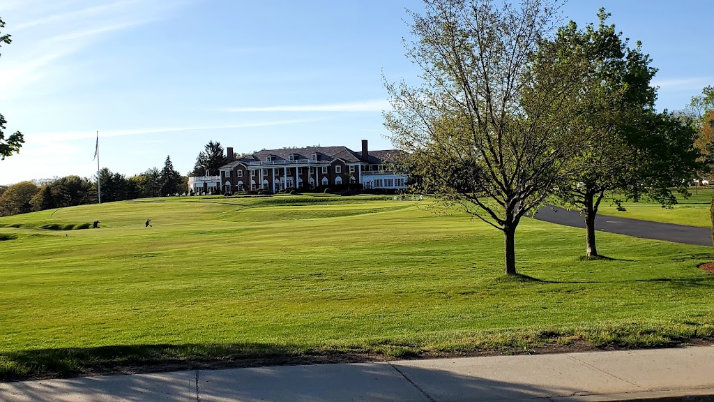 Panoramic view of a lush green golf course at Woodland Golf Club. Smooth