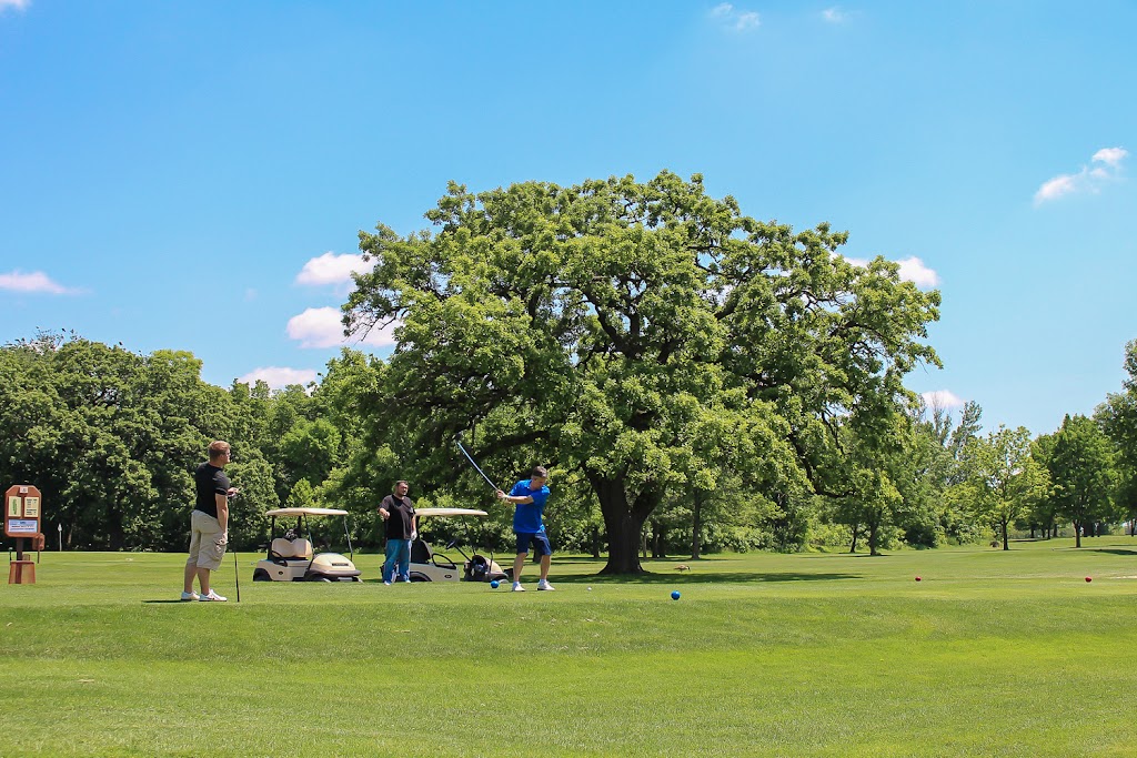 Panoramic view of a lush green golf course at Woodland Hills Golf Course. Smooth