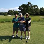 green grass with the flag in the hole.