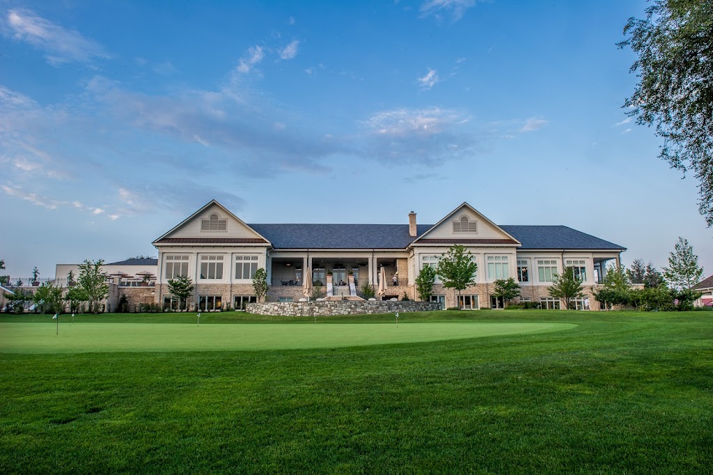 Panoramic view of a lush green golf course at Woodmont Country Club. Smooth