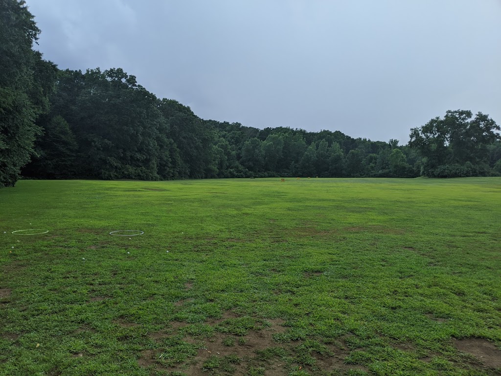 Panoramic view of a lush green golf course at Woodstock Golf Course. Smooth
