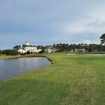 Panoramic view of a lush green golf course at World Tour Golf Links. Smooth