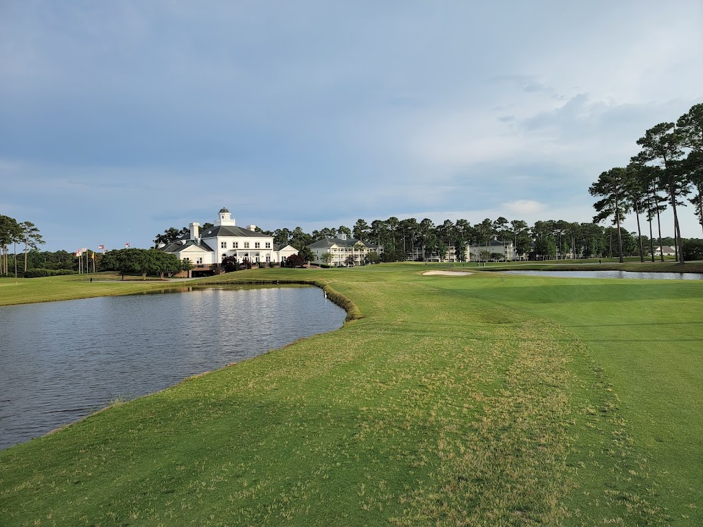 Panoramic view of a lush green golf course at World Tour Golf Links. Smooth