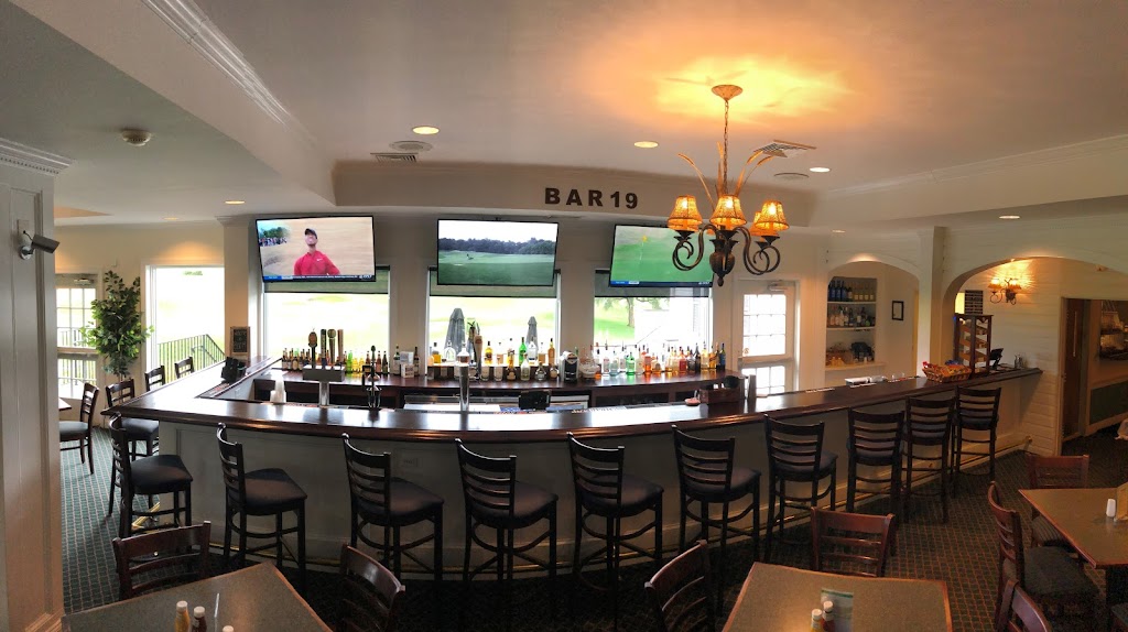 Panoramic view of a lush green golf course at Worthington Manor Golf Club. Smooth