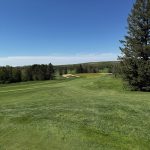 Panoramic view of a lush green golf course at Yahara Hills Golf Course. Smooth