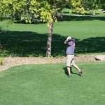 green grass with the flag in the hole.