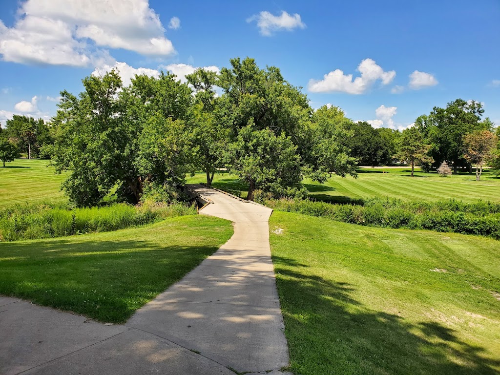 Panoramic view of a lush green golf course at York Country Club. Smooth