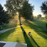 Panoramic view of a lush green golf course at Zintel Creek Golf Course. Smooth