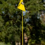 Panoramic view of a lush green golf course at Southern Oaks Championship Golf Course. Smooth