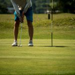 Panoramic view of a lush green golf course at Village Creek Golf Club. Smooth