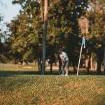 Panoramic view of a lush green golf course at Fall Creek Golf Club. Smooth