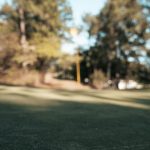 Panoramic view of a lush green golf course at Orchard Ridge Country Club. Smooth