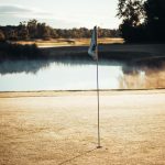 Panoramic view of a lush green golf course at Timber Ridge Golf Course. Smooth