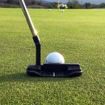 Panoramic view of a lush green golf course at Tri-pond Golf Course. Smooth